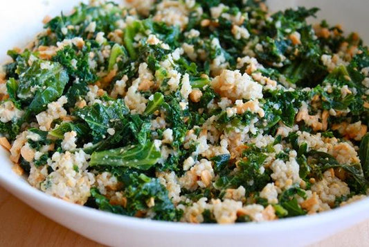 Flash- Fried Kale with Garlic, Almonds, and Cheese served over Cous Cous
